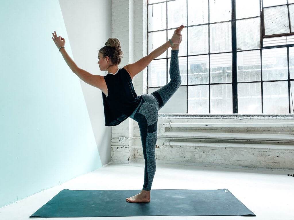 Woman in a graceful Dancer's Pose.