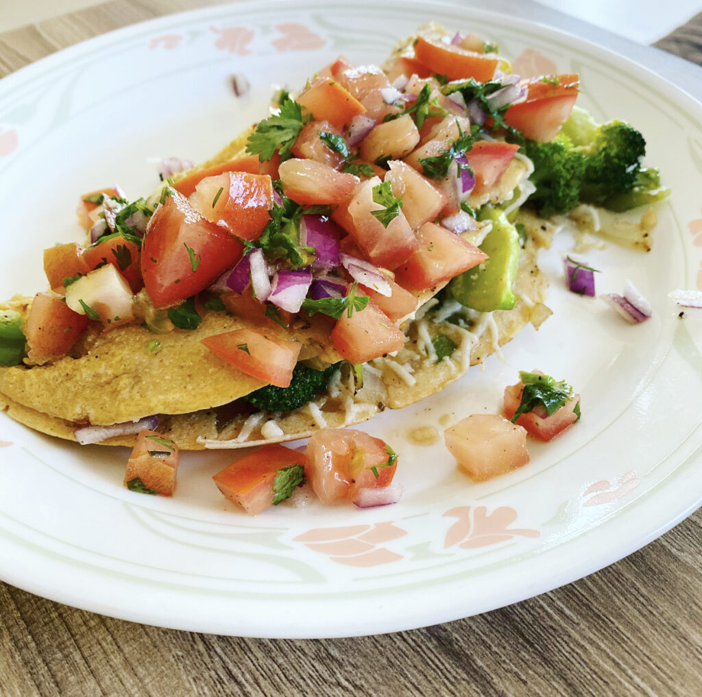 A delicious and fluffy vegan chickpea omelette folded over with vegetable fillings.